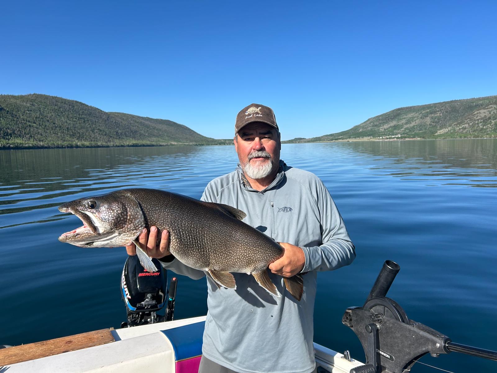 Calm water and a great lake trout.